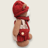 Willow Hearth Permanent Resident shown from the right side, with hand-knitted cream dungarees, rust-red accessories and satchel.