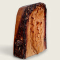 Right-side view of Woodland Face, an original hand-carved lime wood sculpture showing the natural live edge and depth of carving.