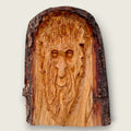Hand-carved woodland face wood sculpture with natural bark edge, handcrafted in the Boyne Valley, Ireland.