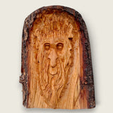 Hand-carved woodland face wood sculpture with natural bark edge, handcrafted in the Boyne Valley, Ireland.